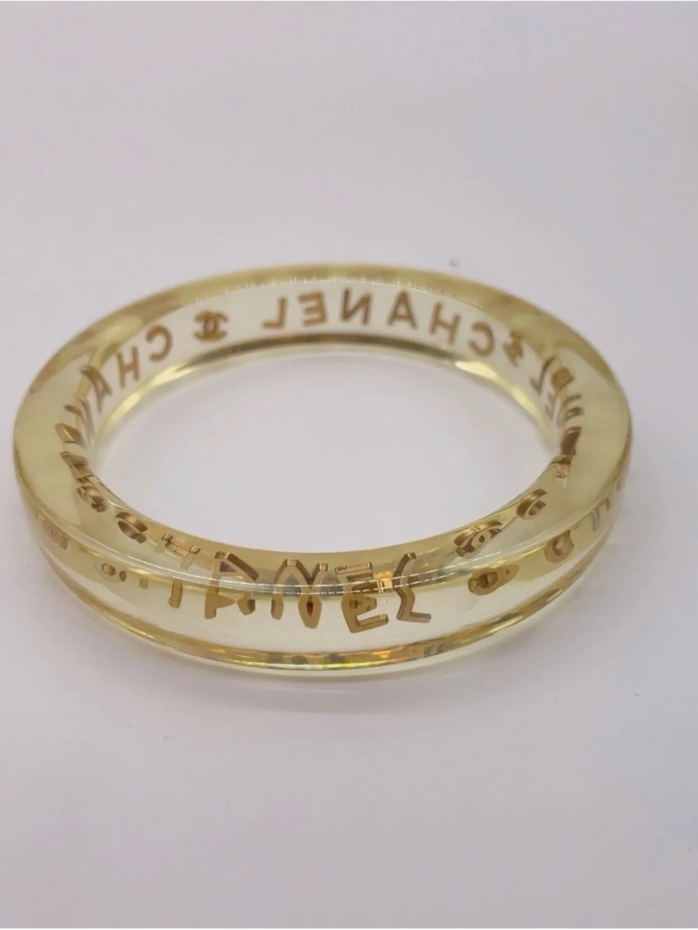 CHANEL LUCITE & Gold Letter Clear Acrylic Bangle - Picture 11 of 12